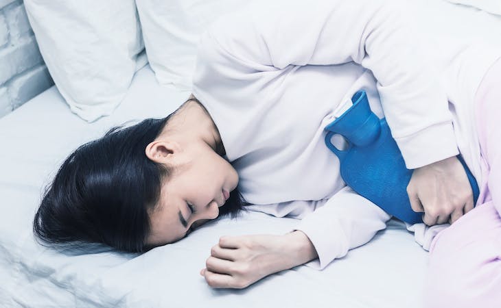 person with uti sleeping in bed